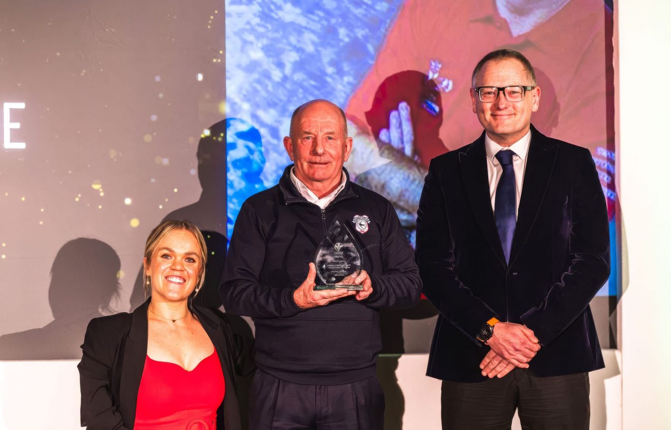 Billy Pye Collecting his award.